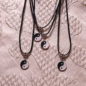 Yin and yang black and white necklace